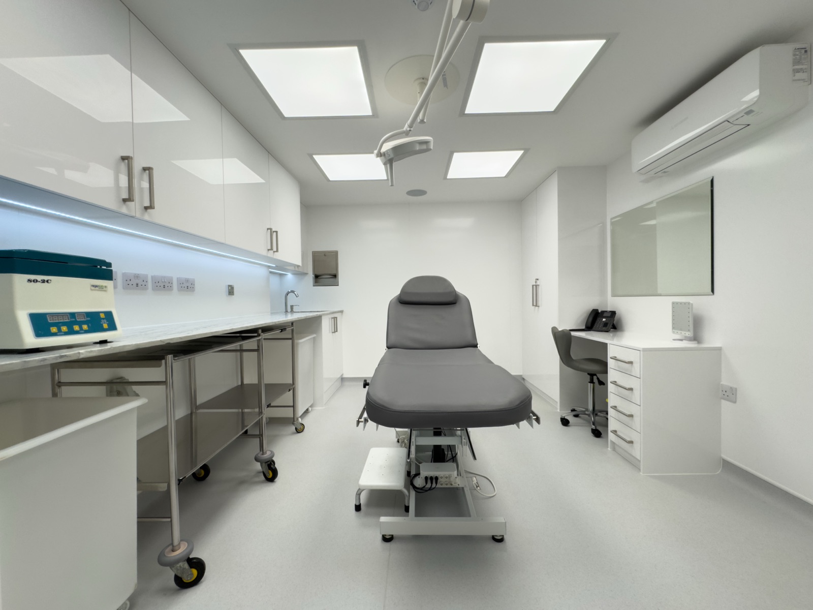 Cosmetics and beauty treatment room at Kensington Cosmetic Clinic with ergonomic treatment chair