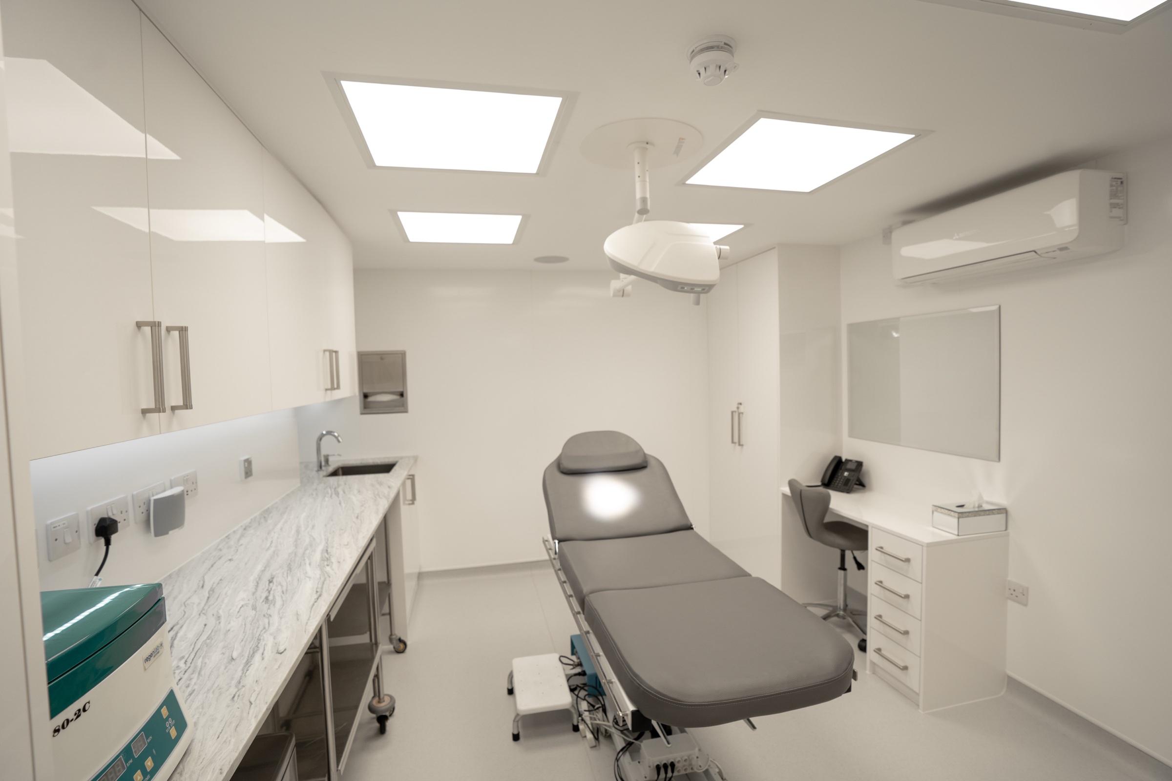Minor procedure room at Kensington Cosmetic Clinic with autoclave and procedure chair