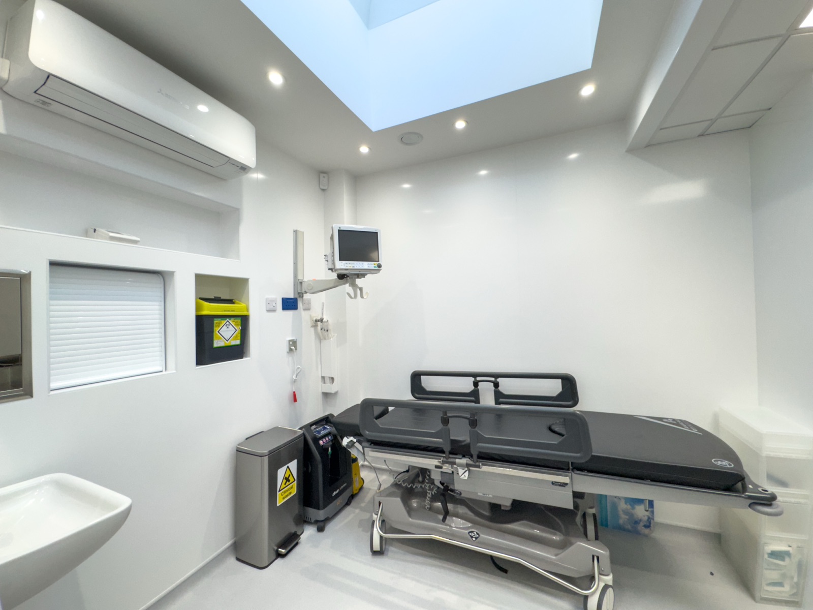 Minor procedure room at Kensington Cosmetic Clinic with autoclave and procedure chair