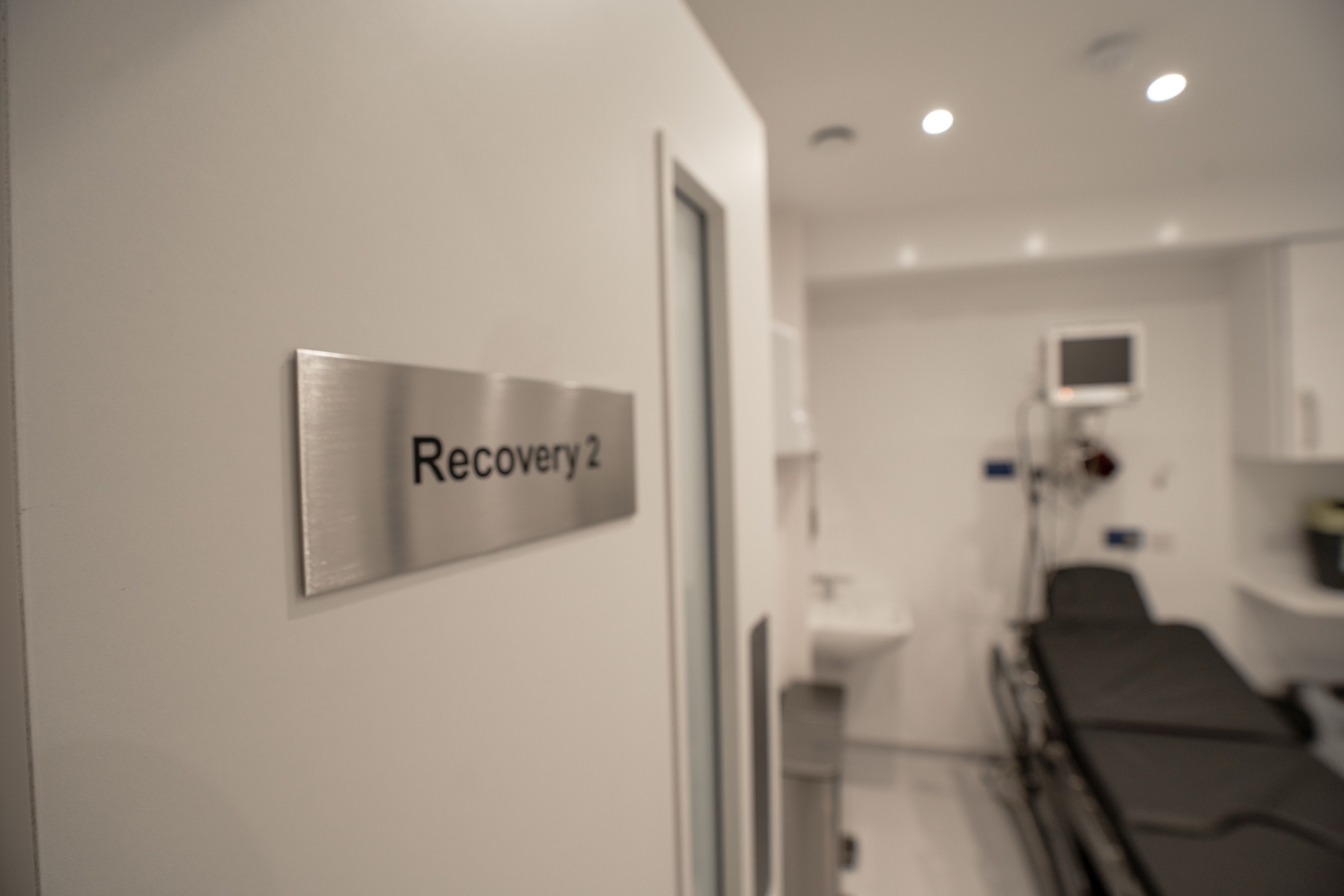 Private recovery suite at Kensington Cosmetic Clinic with vital-signs monitor