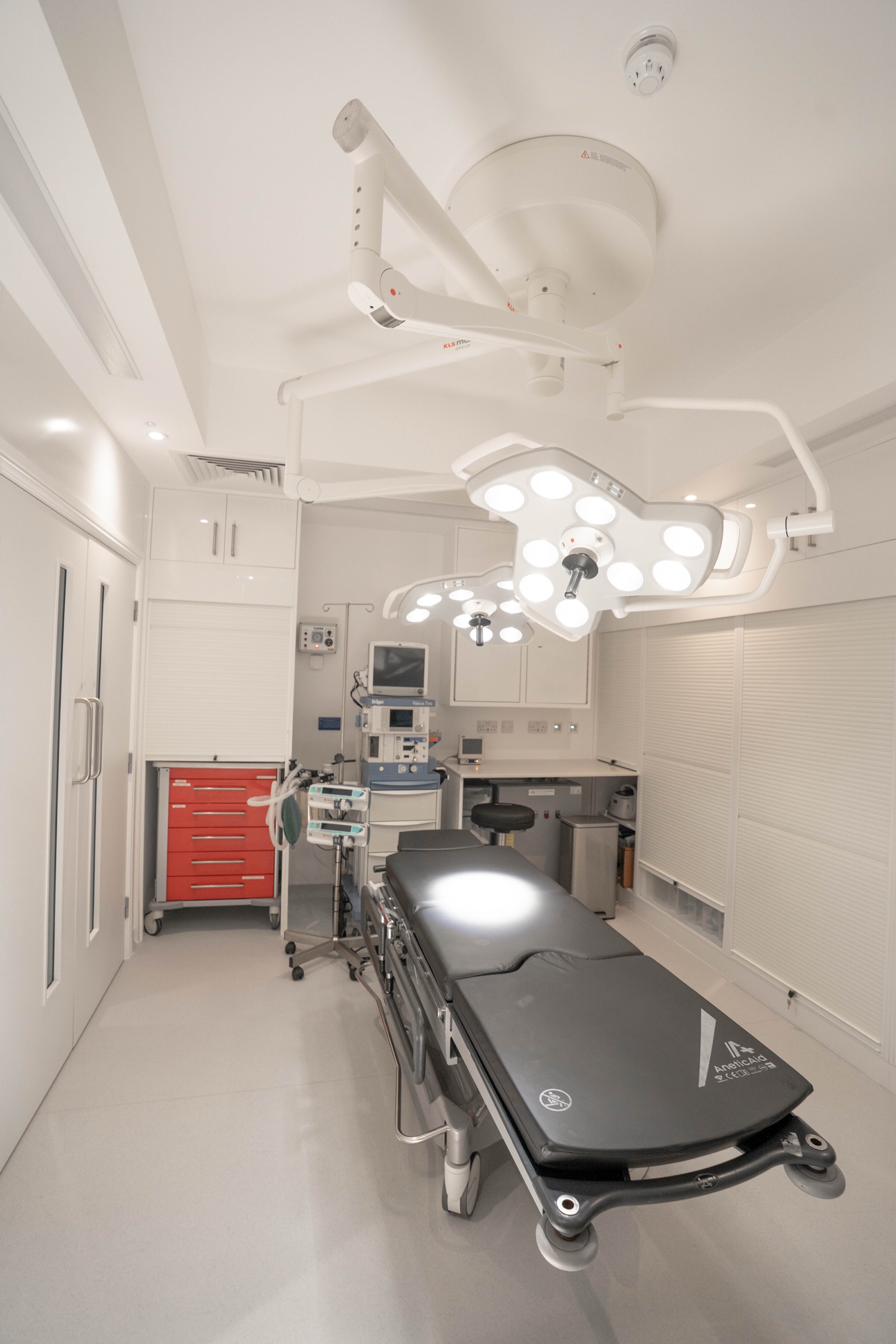 Operating theatre at Kensington Cosmetic Clinic with KLS Martin surgical lights and AneticAid operating table